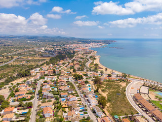 Fototapeta premium The coastline of L'Ampolla, Catalonia, Spain. Drone aerial panorama