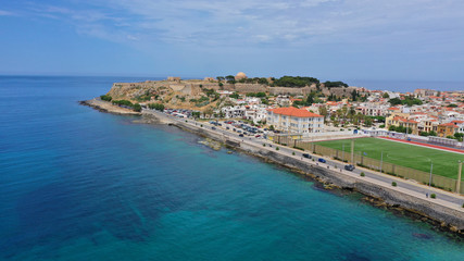 Fototapeta na wymiar Aerial drone photo of unique old picturesque Venetian port with old lighthouse in the heart of famous city of Rethymno, Crete island, Greece