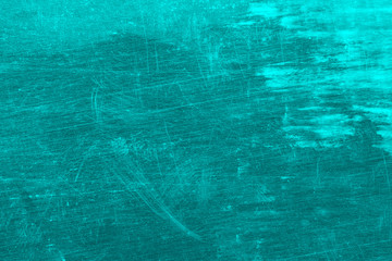 Grunge, dirty, scratched, unevenly colored blue background.