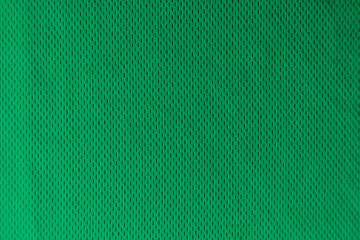 A uniformly lit green fabric texture with soft shadows.