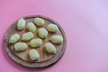Preparing gnocchi stuffed with pesto