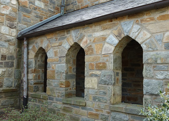 Fototapeta na wymiar set of three stone church windows- exterior view