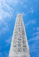 The Luxor Obelisk against blue sky in Paris, France