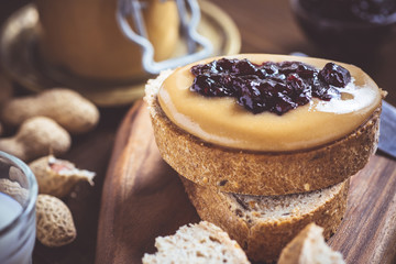 Peanut Butter and Jelly on Rustic Wood Cutting Board. Homemade Healthy Breakfast.