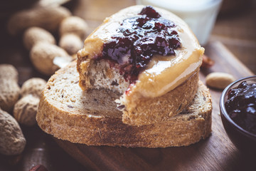 Peanut Butter and Jelly on Rustic Wood Cutting Board. Homemade Healthy Breakfast.