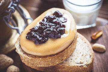 Peanut Butter and Jelly on Rustic Wood Cutting Board. Homemade Healthy Breakfast.