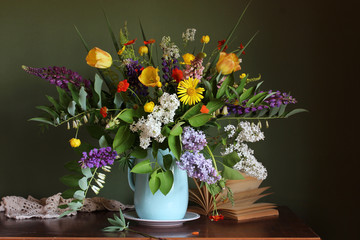 country still life with flowers and an open book on the table. summer garden bouquet