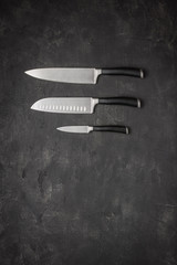 Set of Kitchen Knives on Stone Background