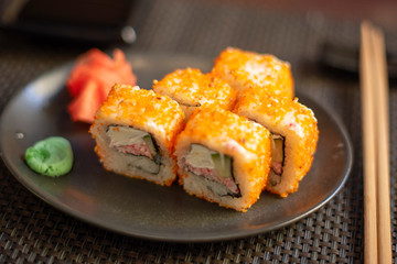 set of California rolls on dark background