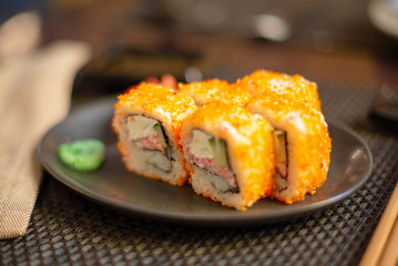 set of California rolls on dark background