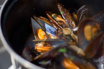 Seafood in Saucepan, mussels. italian restaurant cuisine, healthy delicatessen food. Street market, street trading, healthy food.