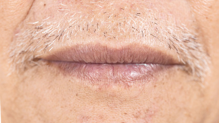 Obraz premium close-up of elderly asian man mouth with wrinkle on face