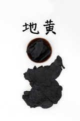 Chinese foxglove rehmannia root herb used in traditional chinese herbal medicine. Calligraphy script reads as chinese rehmannia. Used to help diabetes, anemia, osteoporisis & allergies. Di Huang.