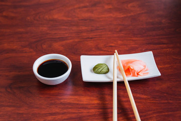 sushi and chopsticks on bamboo mat