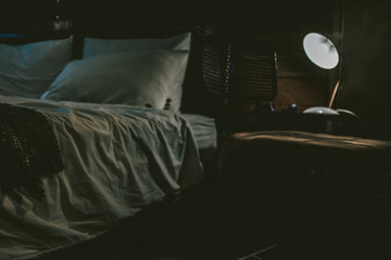 bed in dark room on film simulation