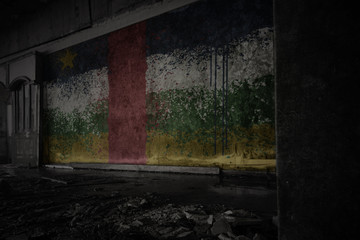 Fototapeta na wymiar painted flag of central african republic on the dirty old wall in an abandoned ruined house.
