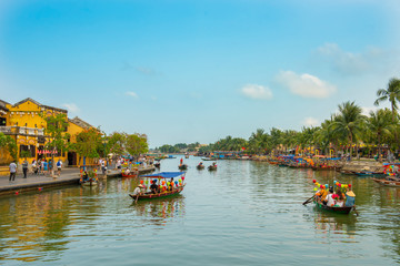 Fototapeta na wymiar tourist boat float at Hoi an river in Old town world heritage site in Vietnam.