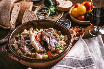 Roasted Lamb Loin Chops with Soybean and Couscous in Rustic Dish