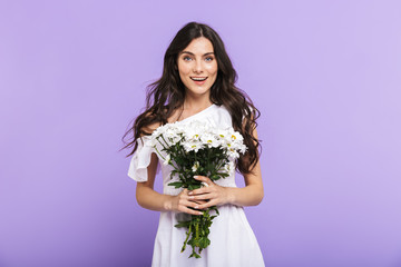 Beautiful young brunette woman standing isolated