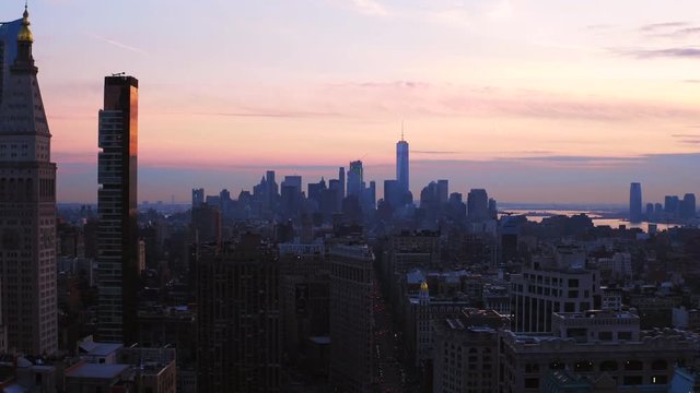 Pan left aerial, New York City skyscrapers at sunrise