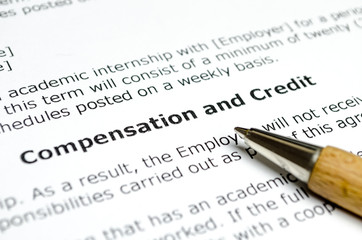 Compensation and Credit with wooden pen