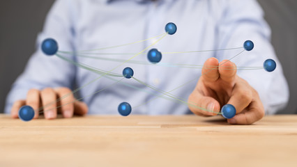 Stack of hands showing unity and teamwork .