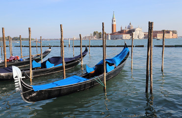 Gondolas and San Giorgio Maggiore island in Venice, Italy