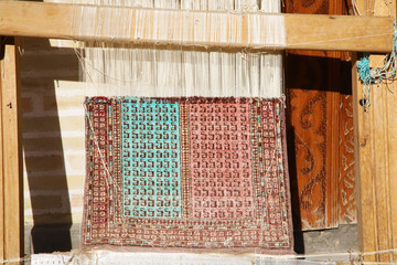 Small loom to weave a carpet in Bukhara, Uzbekistan