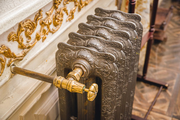 An antique vintage radiator of a centralized heating system