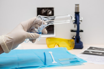 Doctor gynecologist preparing for pelvic examination. Women’s health concept.