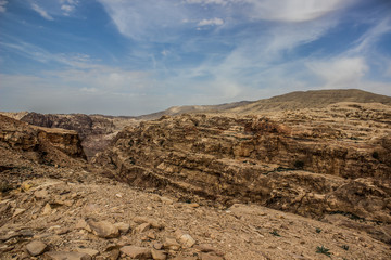 picturesque scenery landscape photography of wilderness and dangerous dry stone sharp rocky mountains and canyons natural environment in Middle East region of Earth, which belong to Bedouins 