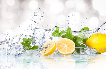 ice cubes, mint leaves with lemons isolated on a white background