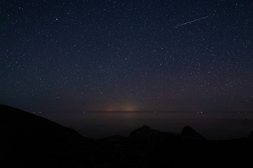 Night landscape with shooting star in Escullos. Natural Park of Cabo de Gata. Andalucia. Spain.