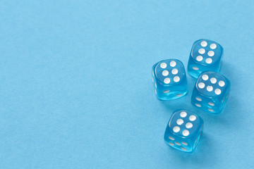 Blue dices on blue background.