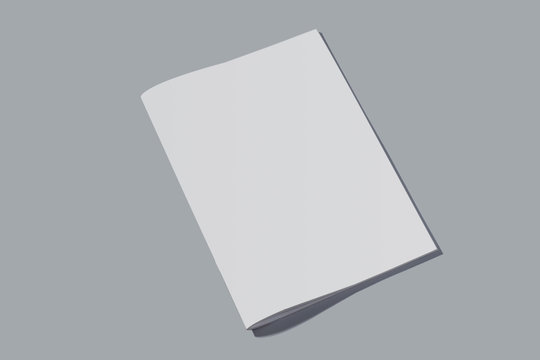 Closed empty notebook with white sheets on grey background