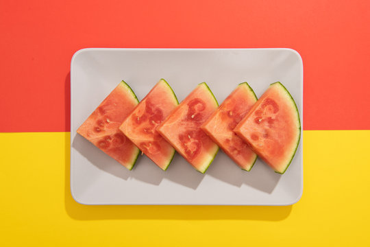 Summer juicy fruit watermelon in colorful background from above