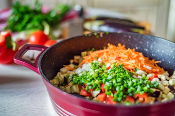 Chopped fresh vegetables in saucepan. Cooking vegetables
