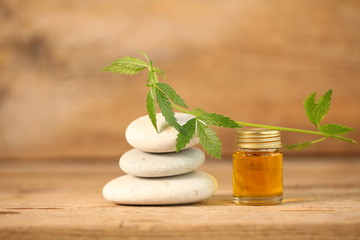 cbd oil bottle and hemp leaf . medical cannabis