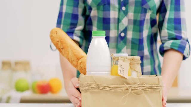 Local buy organic products trade. Farmers market delivery. Milk fruit and french bread in a craft box
