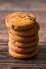 Oat and Chocolate chip cookies on rustic wooden table background