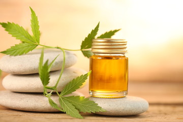 cbd oil bottle and hemp leaf . medical cannabis