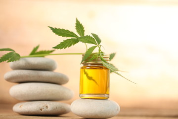 cbd oil bottle and hemp leaf . medical cannabis