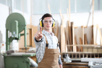 carpenter man touch screen on carpentry background