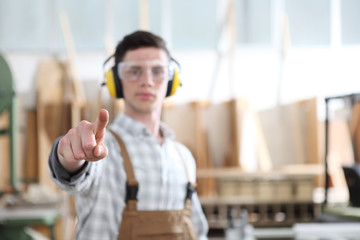 carpenter man touch screen on carpentry background