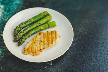 asparagus and chicken breast fillets grill, hollandaise sauce. food background. top