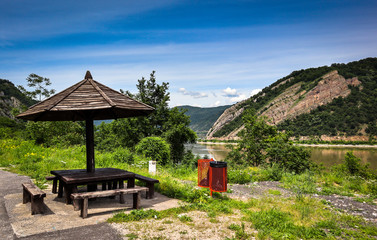 Fototapeta na wymiar Public benches by the road in Djerdap gorge by the Danube river