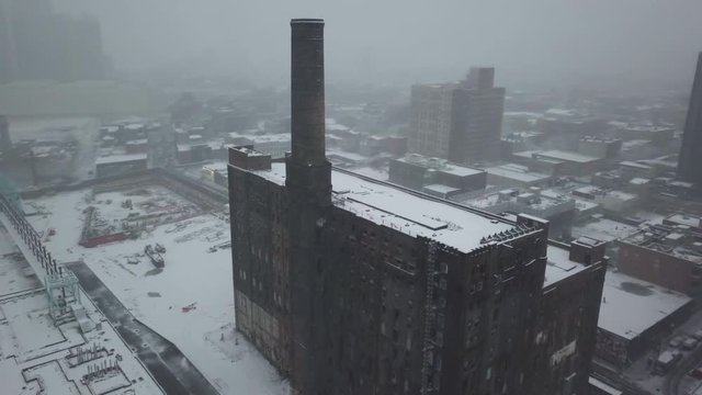 Old building in snowy New York cityscape, aerial