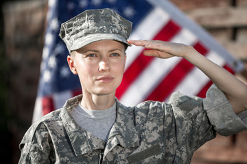 Female US Army Soldier in front of usa flag