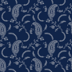 Indigo dye seamless paisley floral pattern. Traditional wood block printed  oriental ethnic motifs of India, Uttar Pradesh, ecru on navy blue background. Textile design.