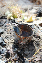 Rusty tin can, trash in the forest, environmental protection